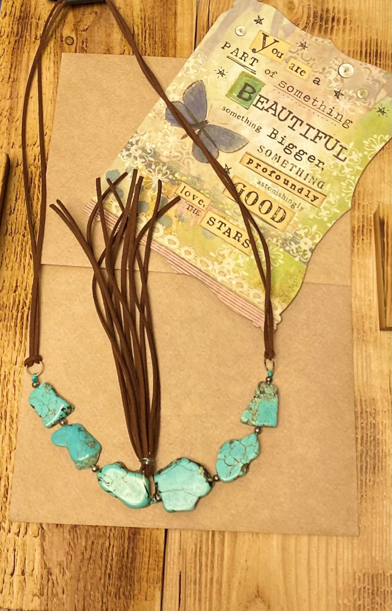 Attitude Necklace with  Brown Leather Strand comes down to 6 large  Turquoise Stones