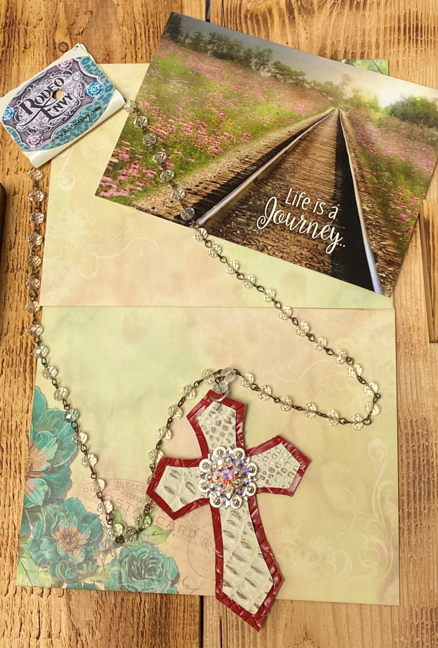 Rodeo Envy 30 inch Clear beaded Chain with Red Tan Cross Cut Out and Jeweled Center